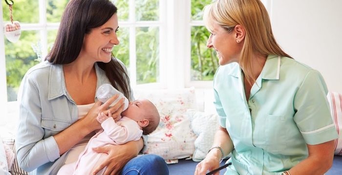 nanny relationship, mother, mom, parent, nanny, baby, bottle, milk, smile, happy, brunette, blonde, green, blue, pink