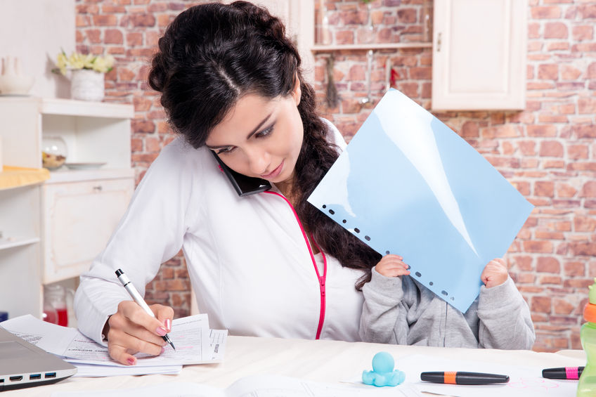 adult, woman, mom, baby, child, work, boss, business, brunette, office, desk, phone, brick, red, writing