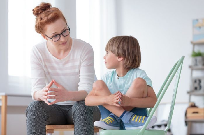 parent, child, chair, blue, white, glasses, talking, conversation, sneakers, discussion